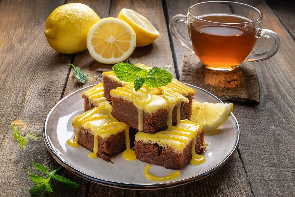 Lemon brownies with lemon glaze served on a plate.