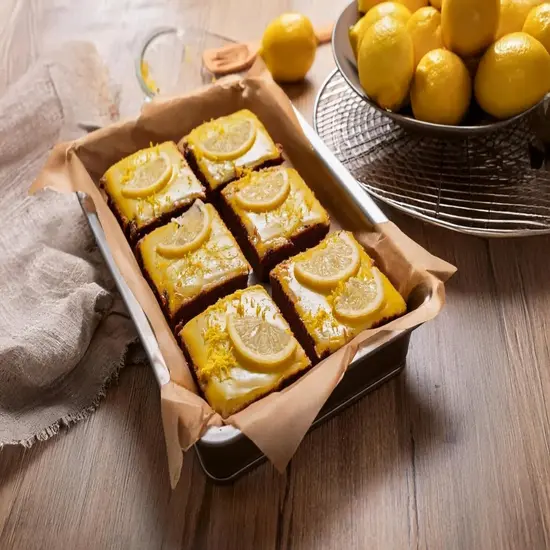 Freshly baked lemon brownies with a lemon glaze.