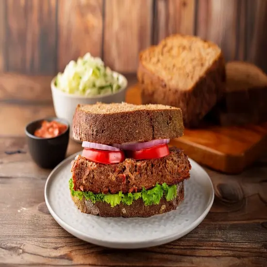 Classic meatloaf sandwich with fresh toppings and coleslaw.