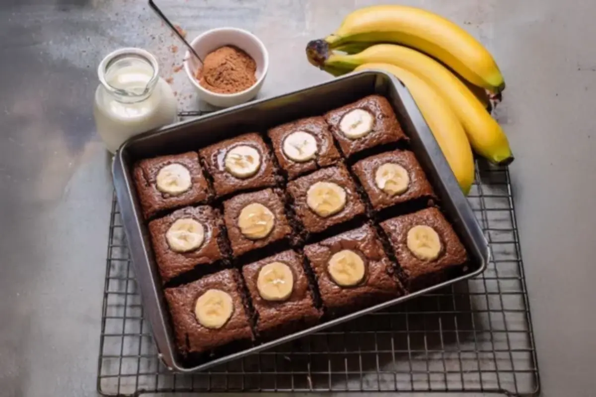 Freshly baked banana brownies cooling on a rack