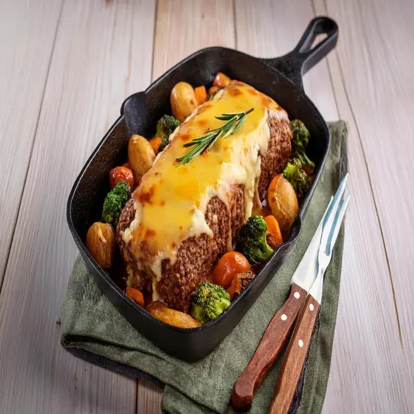 Meatloaf with melted mozzarella and cheddar cheese.