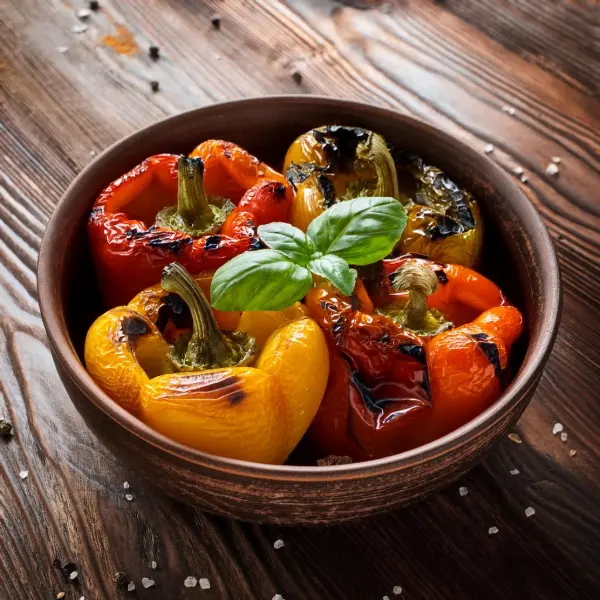 Roasted peppers garnished with fresh herbs