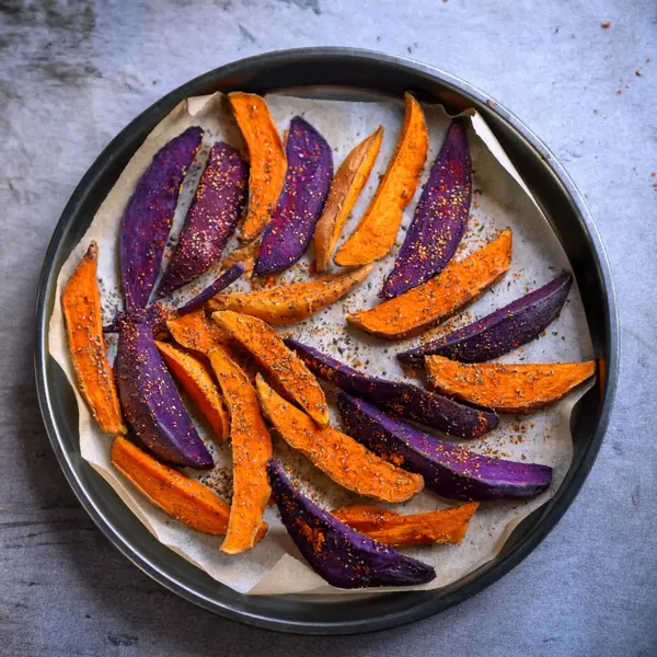 Purple sweet potato wedges ready to bake
