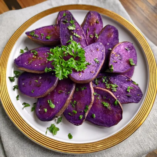 Roasted purple sweet potatoes garnished with parsley
